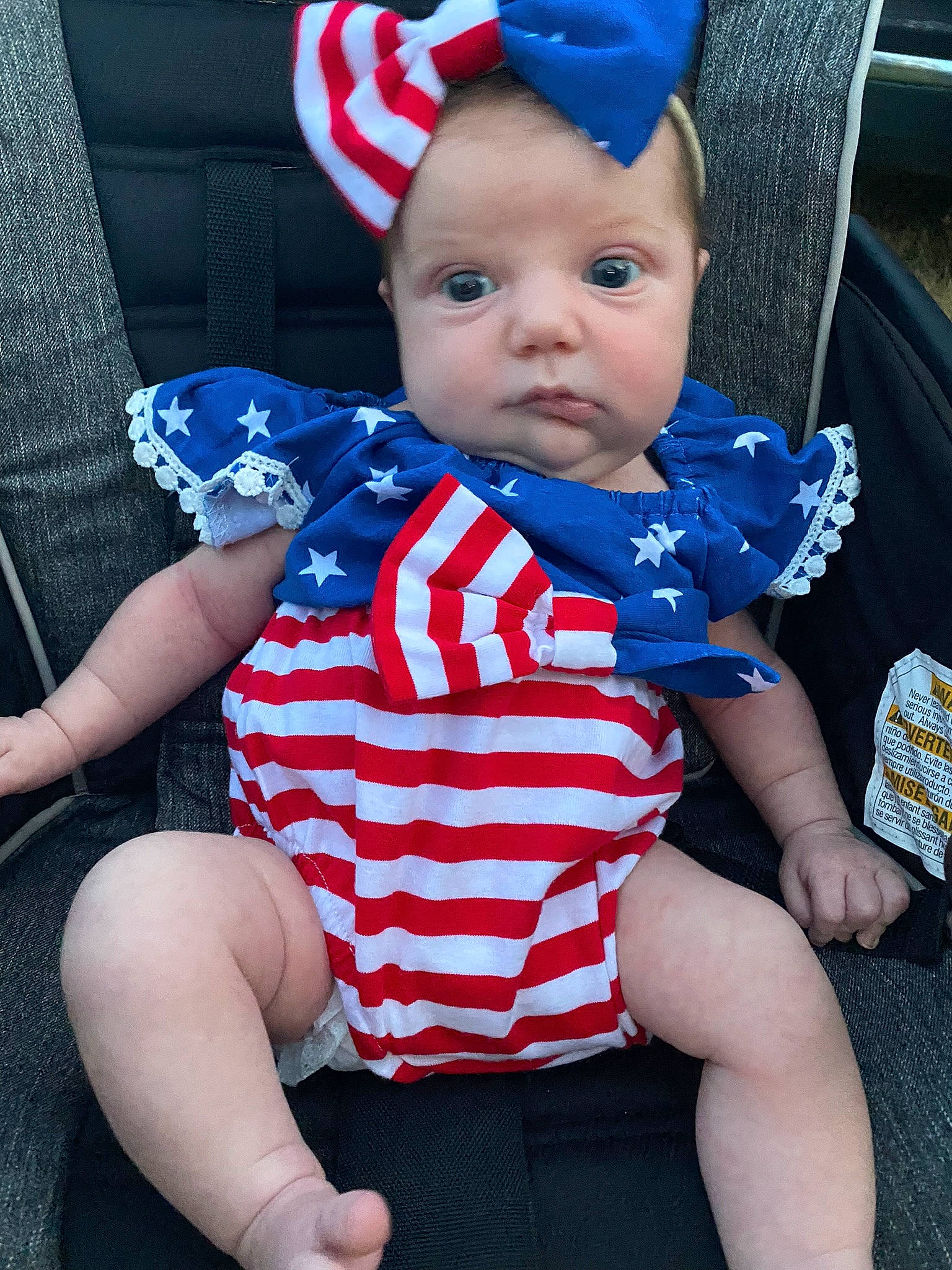 Olivia is registered to the contest to win money with this photo: baby, baby_toddler_clothing, blue, cap, cheek, child, costume_hat, dress, electric_blue, face, fun, happy, hat, headwear, person, pink, red, sitting, sleeve, thigh