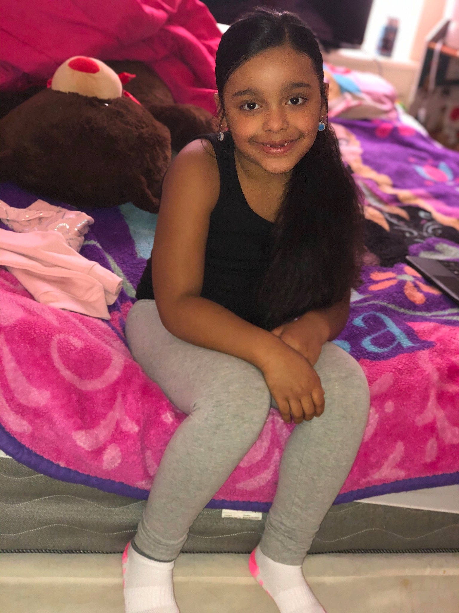 Bella is registered to the contest to win money with this photo: black_hair, facial_expression, fashion, hair, hairstyle, happy, joint, joy, knee, lap, leg, magenta, neck, person, pink, purple, shoulder, skin, smile, textile