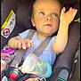 Lucïe participe au concours pour gagner de l'argent avec cette photo : baby, baby_toy, blue_eyes, bottle, car_seat, child, child_safety, cute, face, hand, heart_doodle, indoor, infant, looking_up, pink_clothing, portrait, safety_harness, seatbelt, soft_light, sunlight