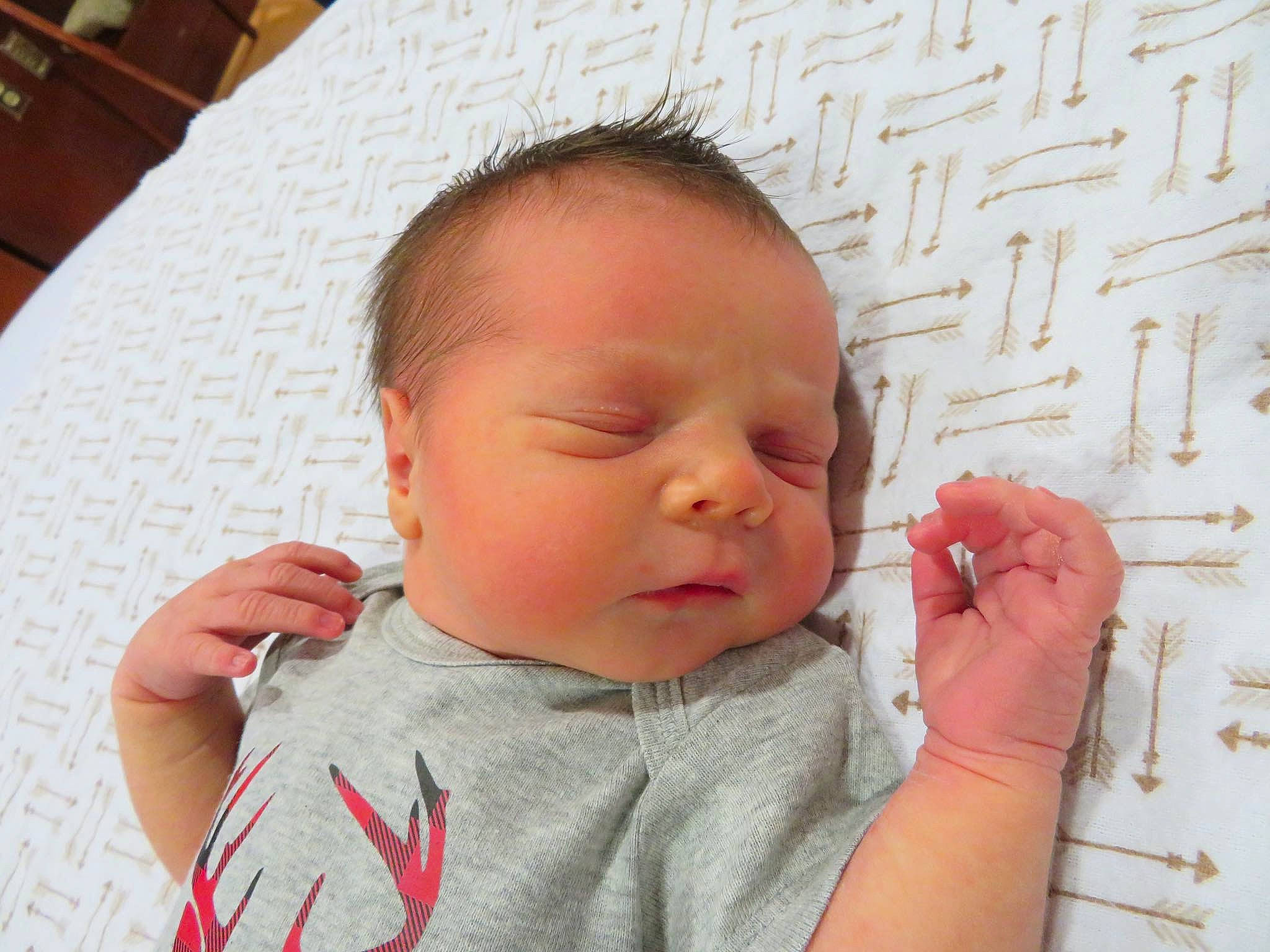 Arrow is registered to the contest to win money with this photo: baby, baby_sleeping, cheek, child, chin, ear, eye, face, finger, forehead, hand, head, lip, mouth, nose, person, skin, thumb, toddler