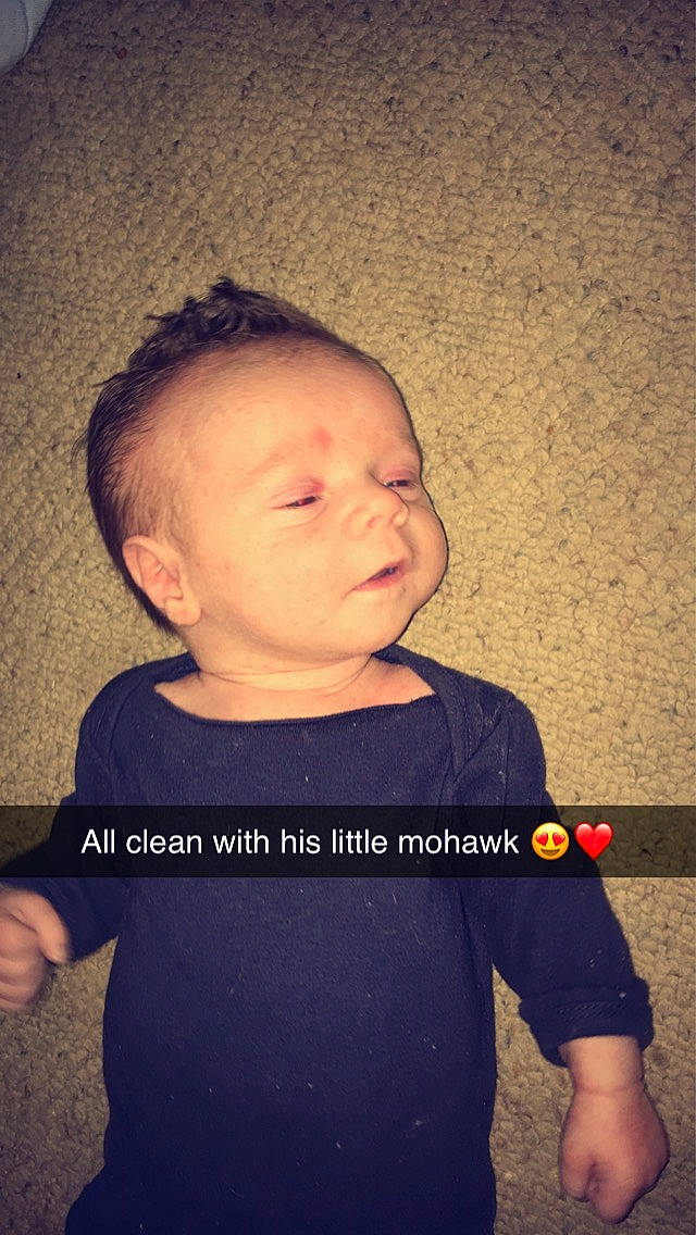 Arrow is registered to the contest to win money with this photo: arm, baby, cheek, child, chin, cool, ear, face, forehead, hair, hairstyle, head, neck, nose, person, photo_caption, play, shoulder, standing, t_shirt