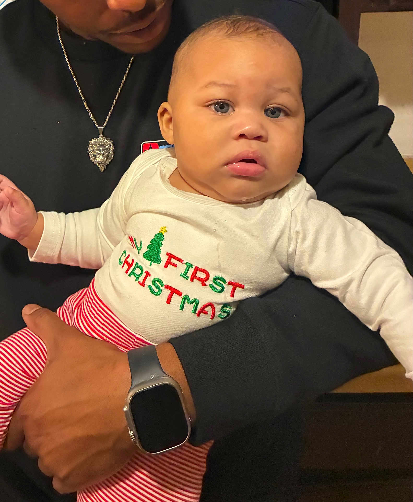 Cicari joined the competition — help win amazing prizes! baby, child, person, holding, christmas, holiday, festive_clothing, striped_pants, blue_eyes, face, expression, sweater, watch, necklace, hand, indoor, closeup, portrait, cute, family