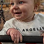 autumn, baby, blue_eyes, child, closeup, clothing, cute, daylight, face, hands, happy, holding, outdoor, park, person, playground, smiling, swing, white_sweatshirt, young