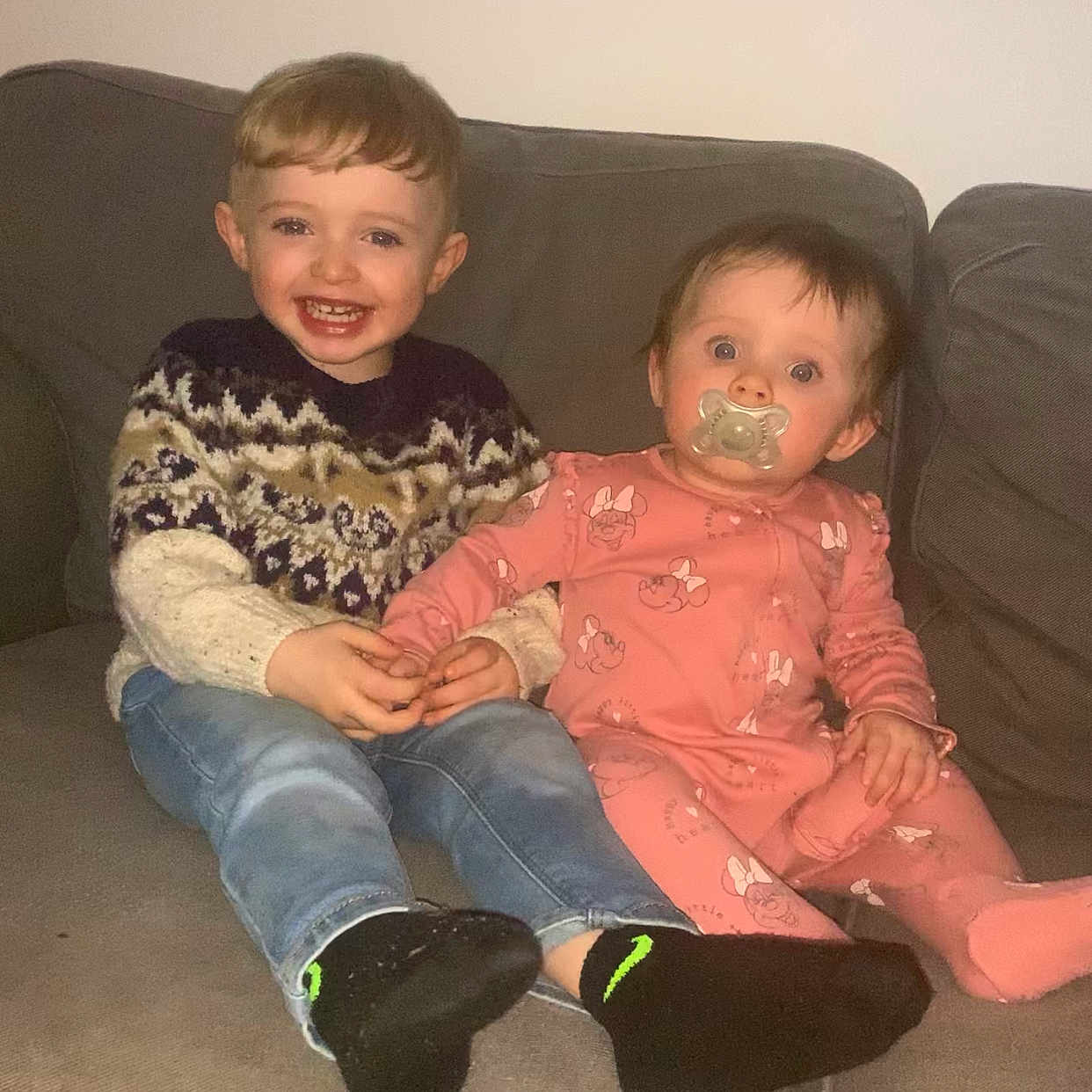 Acer is registered to the contest to win money with this photo: baby, boy, child, clothing, couch, cushion, face, footwear, furniture, head, homedecor, hosiery, jeans, male, pants, person, photography, portrait, sitting, sock