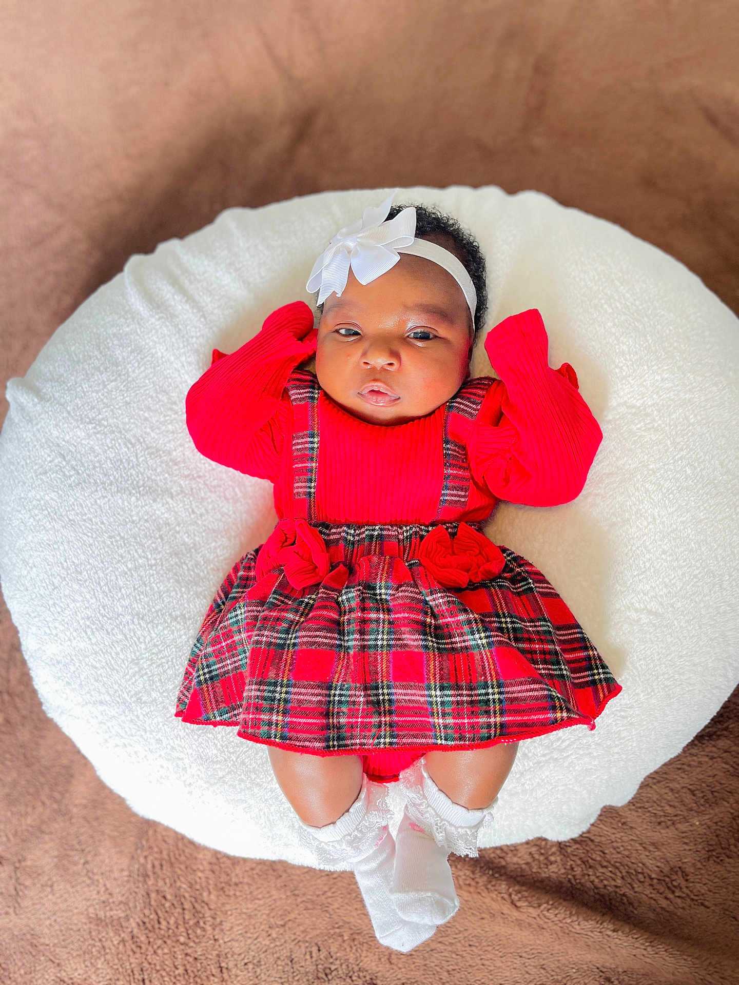 Chavonne joined the competition — help win amazing prizes! adorable, baby, blanket, bow, child, cushion, cute, dress, headband, holiday_outfit, indoor, infant, lying_down, plaid, portrait, red_clothing, soft_texture, warm_colors, white_socks, young_child