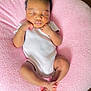 Chavonne is registered to the contest to win money with this photo: baby, child, cozy, curly_hair, cushion, cute, feet, hands, indoor, infant, newborn, onesie, peaceful, pink, portrait, relaxation, resting, skin, sleeping, soft