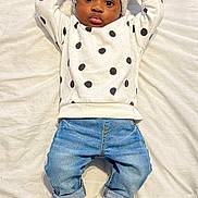 Carrick is registered to the contest to win money with this photo: baby, beanie, bodypart, bonnet, cap, clothing, face, footwear, hat, head, jeans, knitwear, pants, pattern, person, photography, portrait, shoe, sneaker, sweater