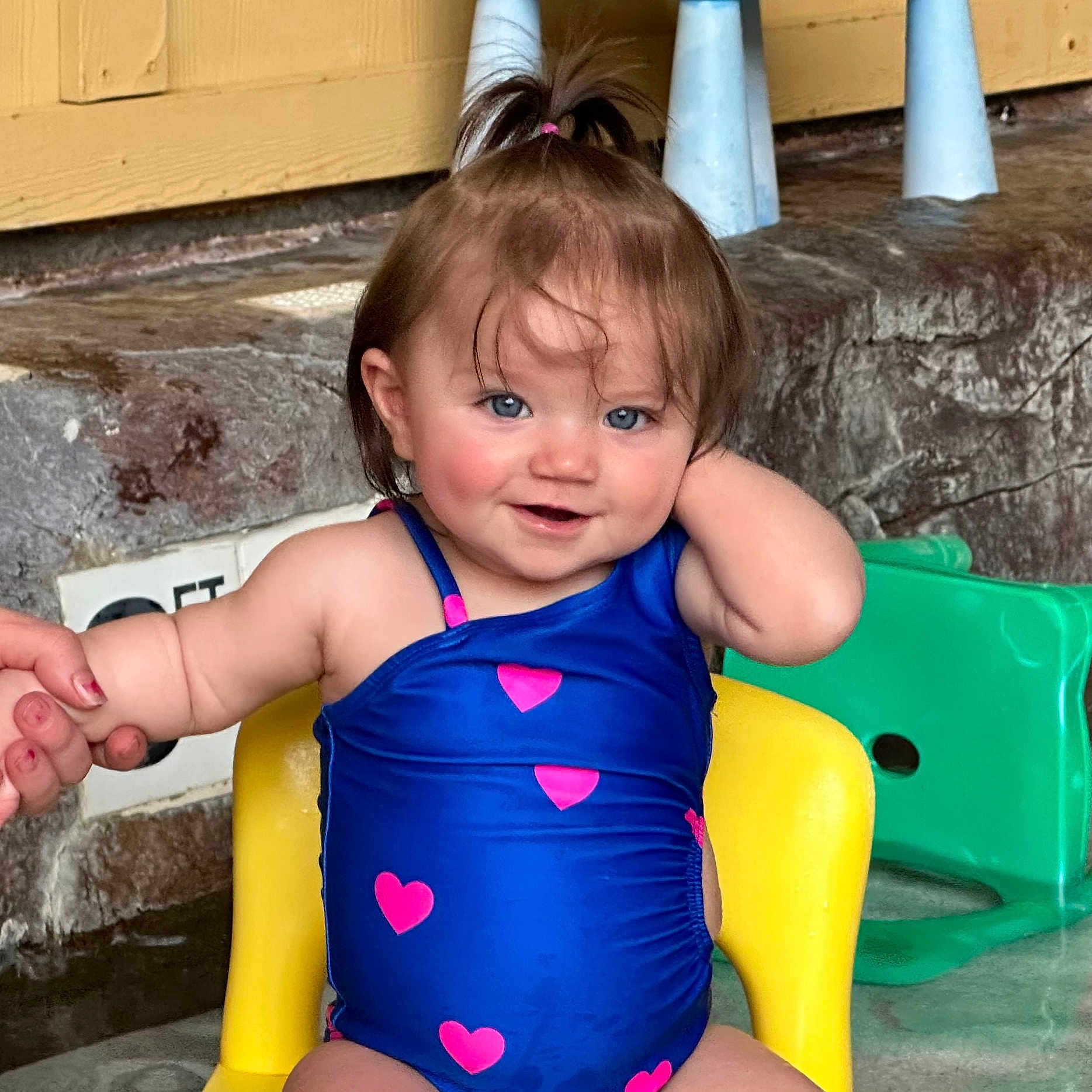 Oaklynn joined the competition — help win amazing prizes! baby, bodypart, chair, clothing, dress, face, finger, frown, furniture, hand, head, person, photography, pool, portrait, sad, sitting, summer, swimwear, water