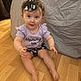 Lola participe au concours pour gagner de l'argent avec cette photo : baby, child, infant, floor, headband, heart_pattern, purple_top, shorts, sitting, curious, indoor, wooden_floor, clothing, person, cute, smiling, face, human, young, portrait