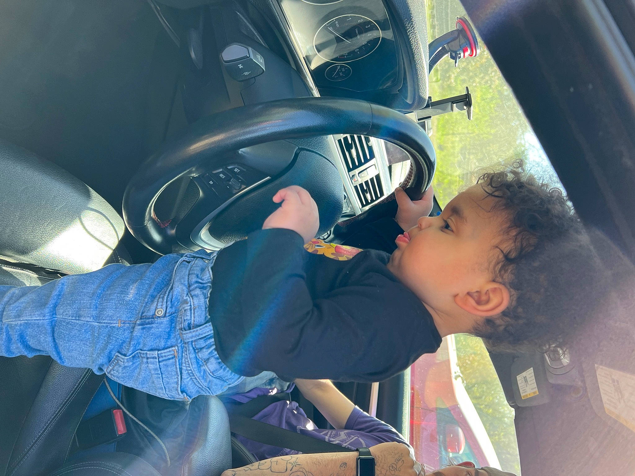 Greyson joined the competition — help win amazing prizes! auto_part, automotive_design, automotive_exterior, automotive_lighting, automotive_tire, automotive_wheel_system, automotive_window_part, car, car_seat, electric_blue, family_car, fender, hood, motor_vehicle, person, personal_luxury_car, steering_wheel, toddler, vehicle, vehicle_door