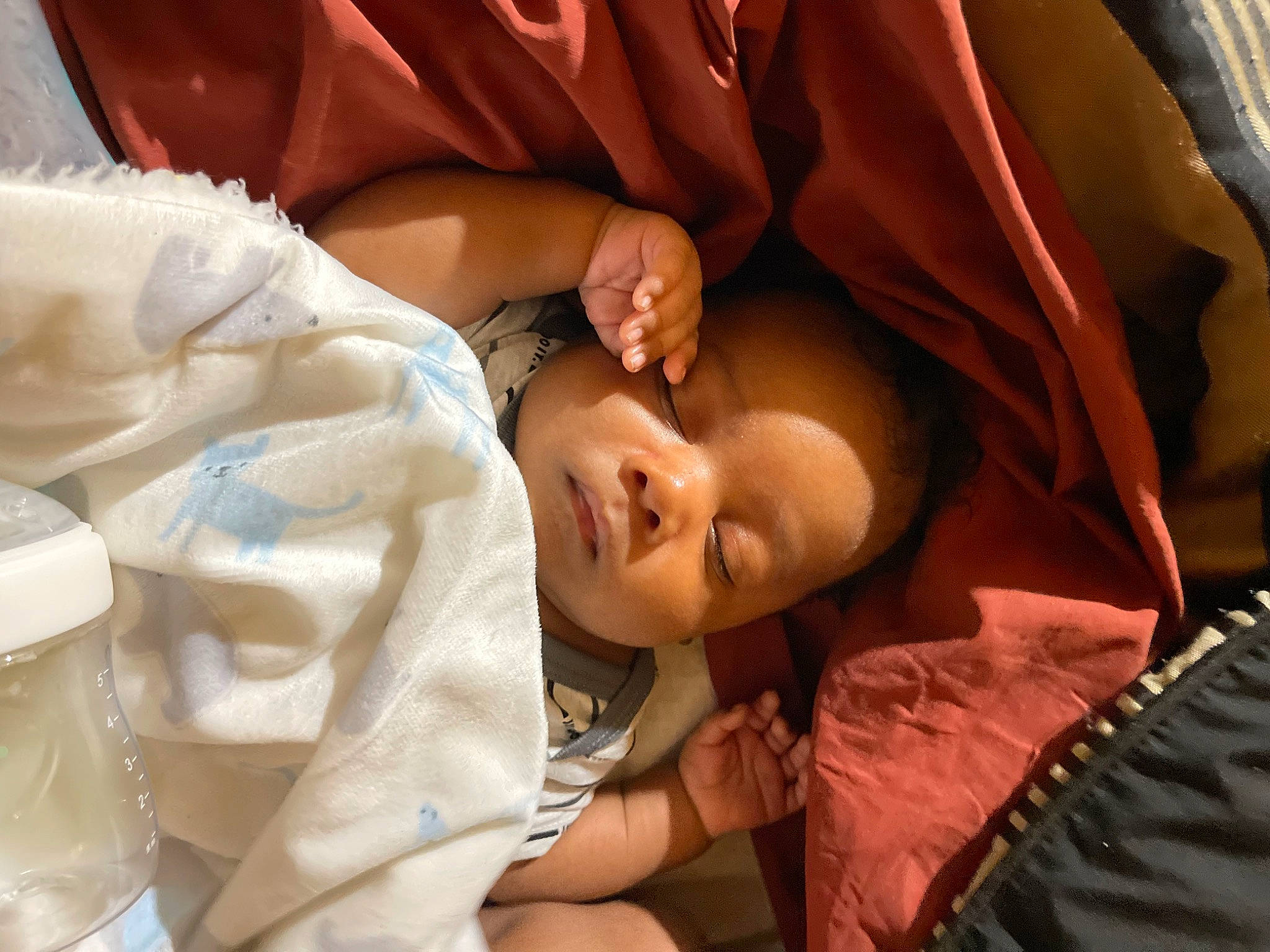 Diovel is registered to the contest to win money with this photo: abdomen, baby, baby_products, cheek, child, comfort, event, eye, flash_photography, fun, happy, human_body, mammal, mouth, person, room, sitting, sleep, smile, toddler