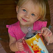 Oakleigh is registered to the contest to win money with this photo: toddler, child, smiling, blue_eyes, pink_dress, sippy_cup, winnie_the_pooh, polka_dots, indoor, wooden_floor, barefoot, cute, happy, person, holding, drinkware, short_hair, earrings, portrait, standing