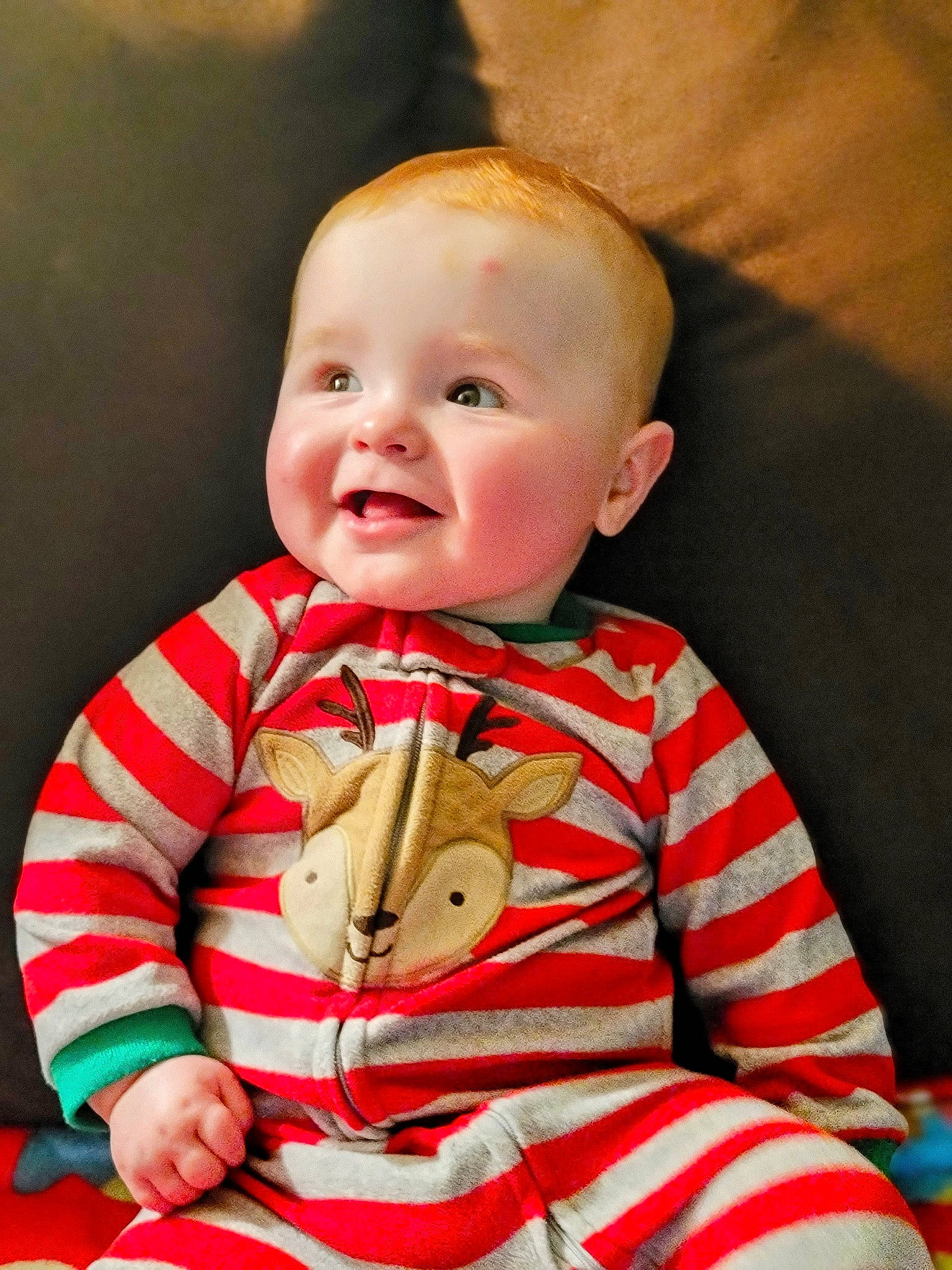 Charlie is registered to the contest to win money with this photo: arm, baby_toddler_clothing, cheek, chin, dress, eye, face, facial_expression, hair, hairstyle, head, human_body, iris, joy, lip, mouth, neck, nose, person, skin