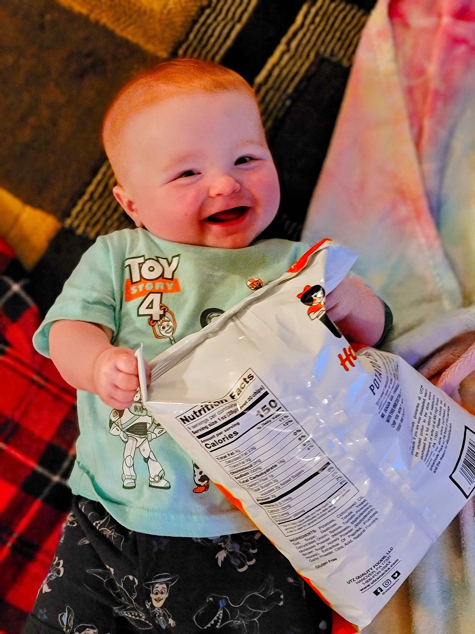 Charlie joined the competition — help win amazing prizes! baby, baby_products, baby_toddler_clothing, cheek, child, comfort, fun, happy, laugh, linens, paper, pattern, person, plaid, sitting, sleeve, smile, t_shirt, tartan, textile