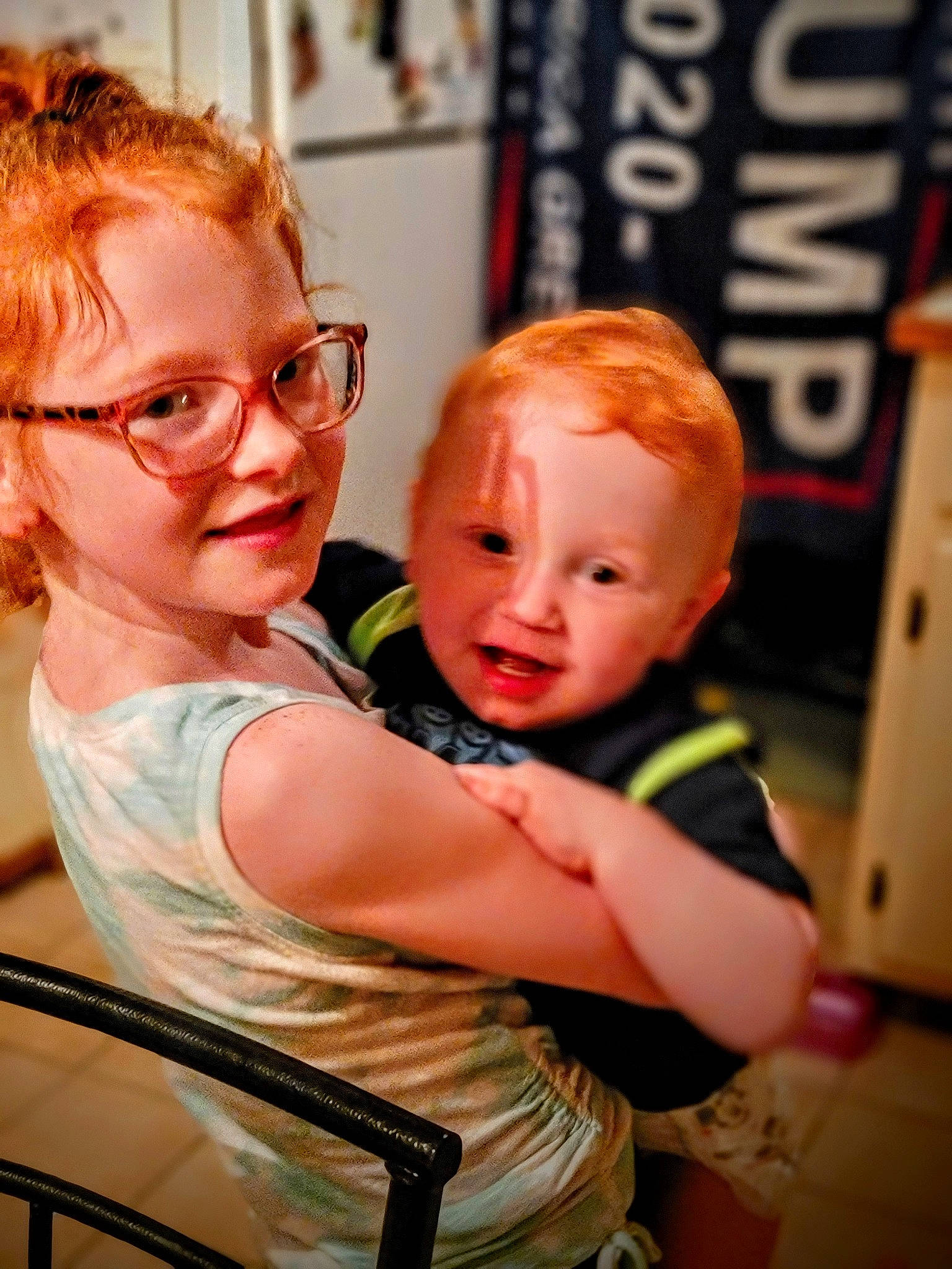 Caylee is registered to the contest to win money with this photo: blond, chair, cheek, child, event, eye, eyewear, fun, gesture, glasses, goggles, hairstyle, happy, joy, leisure, logo, person, sitting, skin, smile