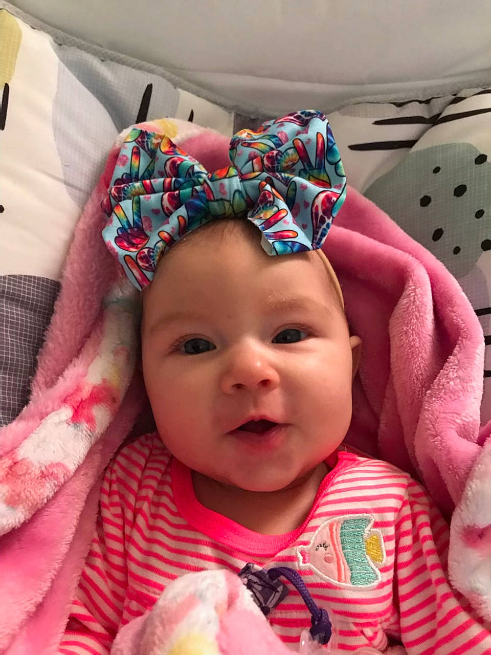 Berkley is registered to the contest to win money with this photo: baby, baby_toddler_clothing, cap, cheek, chin, eye, face, happy, head, headgear, headwear, iris, linens, lip, nose, pattern, person, pink, skin, smile