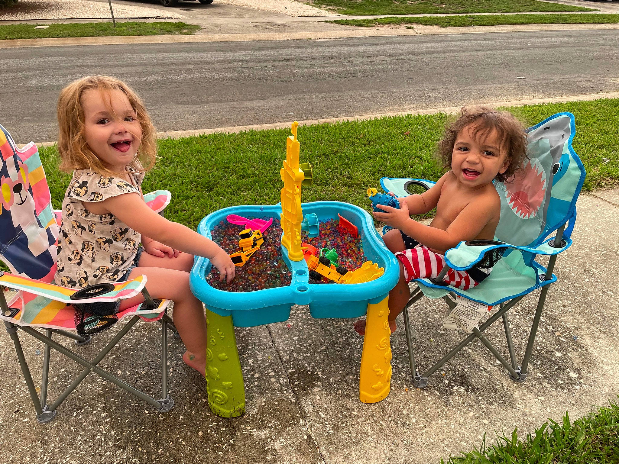 Kevin Jr joined the competition — help win amazing prizes! baby, baby_toddler_clothing, chair, child, city, dress, fun, grass, leisure, outdoor_furniture, people_in_nature, person, plant, recreation, sharing, smile, summer, table, tire, toddler