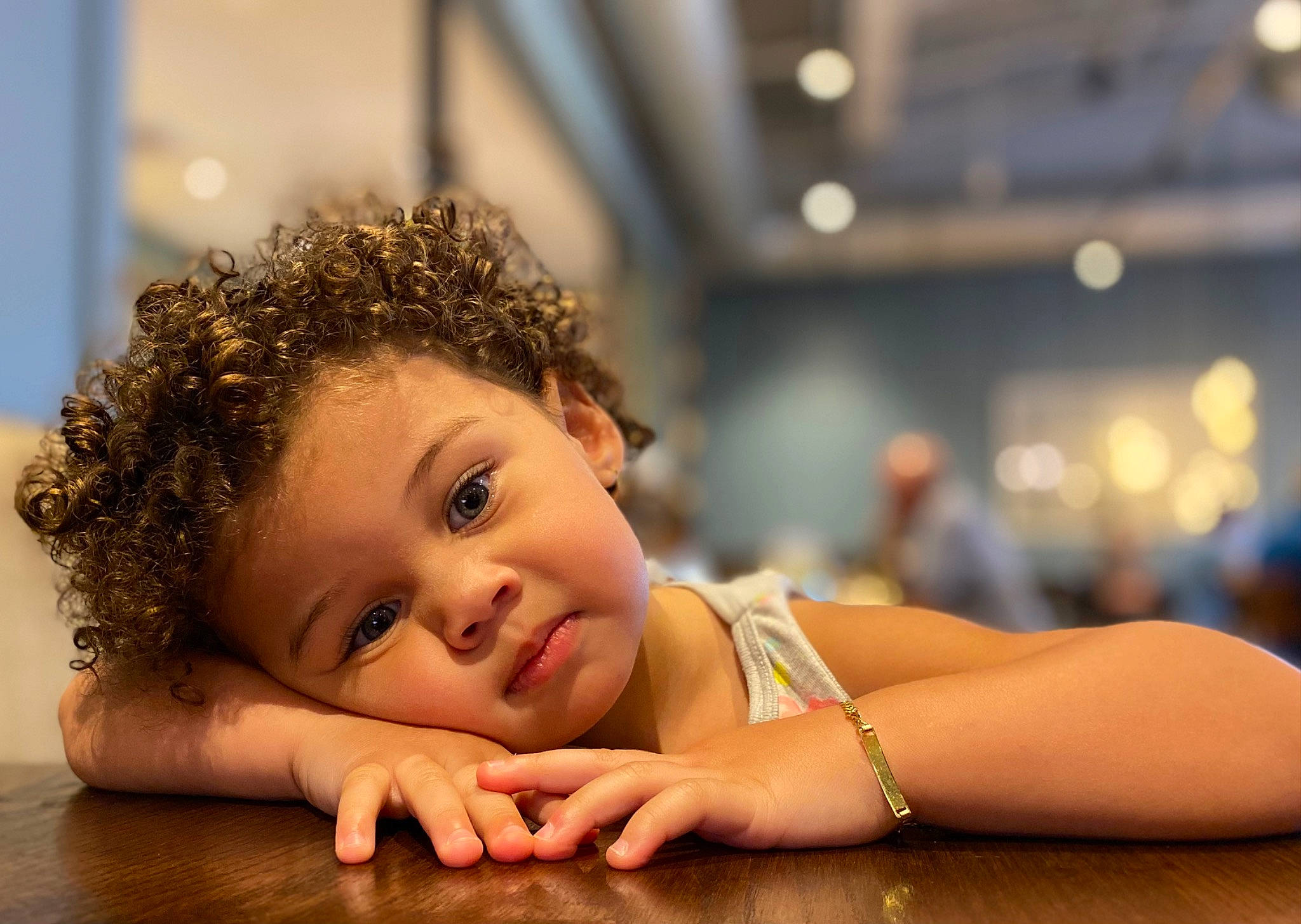 Amaia is registered to the contest to win money with this photo: arm, cheek, child, close_up, eye, flash_photography, flooring, fun, gesture, hairstyle, happy, hardwood, leisure, lip, nail, person, skin, smile, thumb, toddler