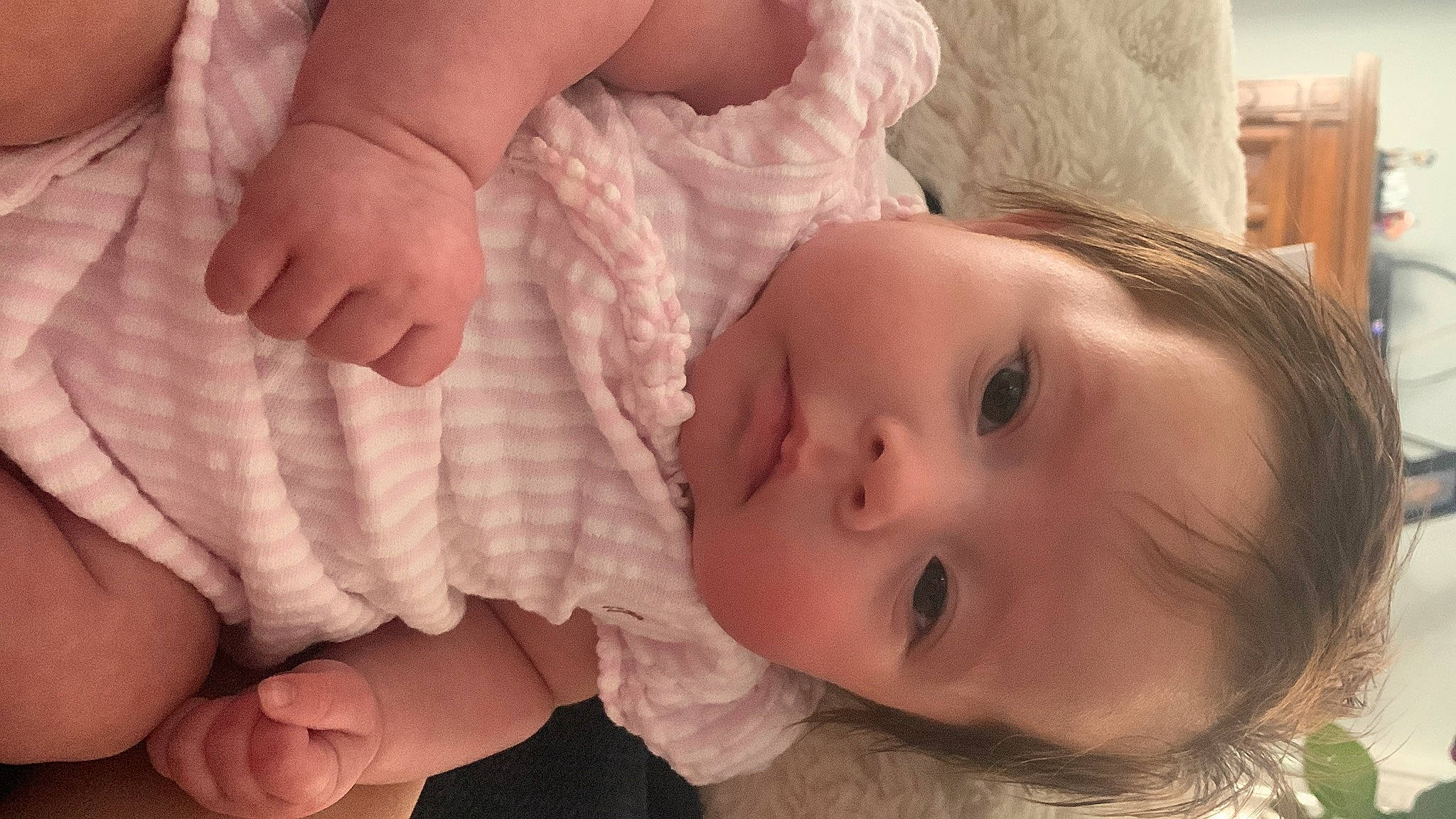 Giovanna is registered to the contest to win money with this photo: baby, baby_toddler_clothing, cheek, chin, comfort, eye, eyelash, finger, gesture, hand, happy, human_body, iris, lip, mouth, nail, neck, nose, person, skin