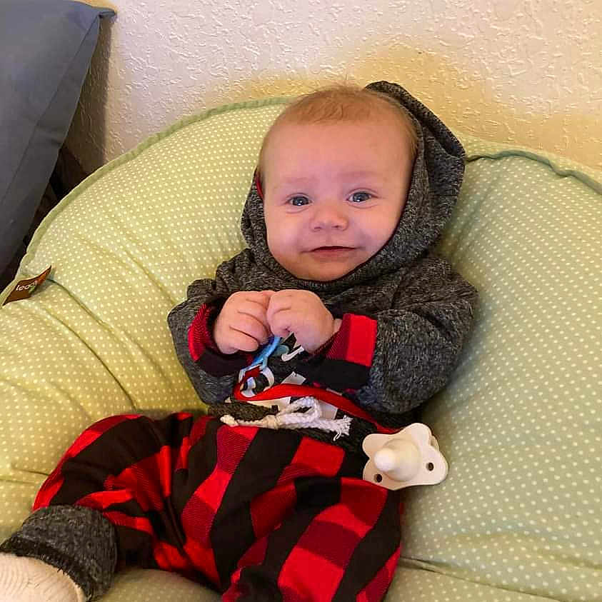 Kayson is registered to the contest to win money with this photo: baby, babylaughing, beanbag, blanket, clothing, face, furniture, happy, head, person, sitting, sleeve