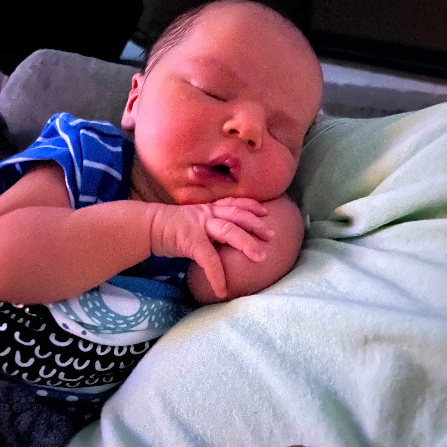 Weston is registered to the contest to win money with this photo: baby, sleeping, infant, child, peaceful, cute, onesie, blue_stripes, hands, face, chubby_cheeks, resting, pacifier, soft_surface, closeup, indoors, portrait, newborn, cute_baby, peaceful_sleep