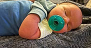 Weston joined the competition — help win amazing prizes! baby, blanket, blue_clothing, child, comfort, cozy, cute, hand, head, indoors, infant, newborn, pacifier, peaceful, portrait, relaxation, resting, skin, sleeping, soft_texture