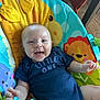 August joined the competition — help win amazing prizes! baby, smiling, infant, onesie, child, colorful, baby_seat, lion, hippo, toy, indoor, floor, wooden_floor, happy, cute, person, toddler, clothing, seat, playful