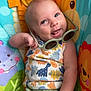 August joined the competition — help win amazing prizes! baby, child, sunglasses, smiling, dinosaur_pattern, colorful, baby_seat, animal_print, happy, cute, infant, clothing, green_shorts, playful, portrait, indoors, toy, fun, young, cheerful