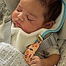 Milo is registered to the contest to win money with this photo: baby, sleeping, car_seat, blanket, pacifier_clip, infant, child, cozy, cute, peaceful, soft, clothing, hand, face, head, resting, indoors, newborn, toddler, comfort