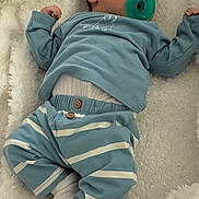 Milo joined the competition — help win amazing prizes! baby, sleeping, pacifier, blue_clothing, striped_pants, blanket, soft_texture, infant, cozy, child, cute, resting, indoors, newborn, comfort, white_socks, nursery, peaceful, portrait, lying_down