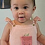 baby, child, infant, portrait, cute, knitted_clothing, pink_outfit, strawberry, smiling_face, indoor, person, young_child, eyes, face, sleeveless, happy, closeup, adorable, skin, head