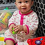 Ashlee joined the competition — help win amazing prizes! baby, child, onesie, toy, playpen, smile, indoor, colorful, block, infant, cute, happy, sitting, floor, pattern, hand, foot, face, playtime, bright