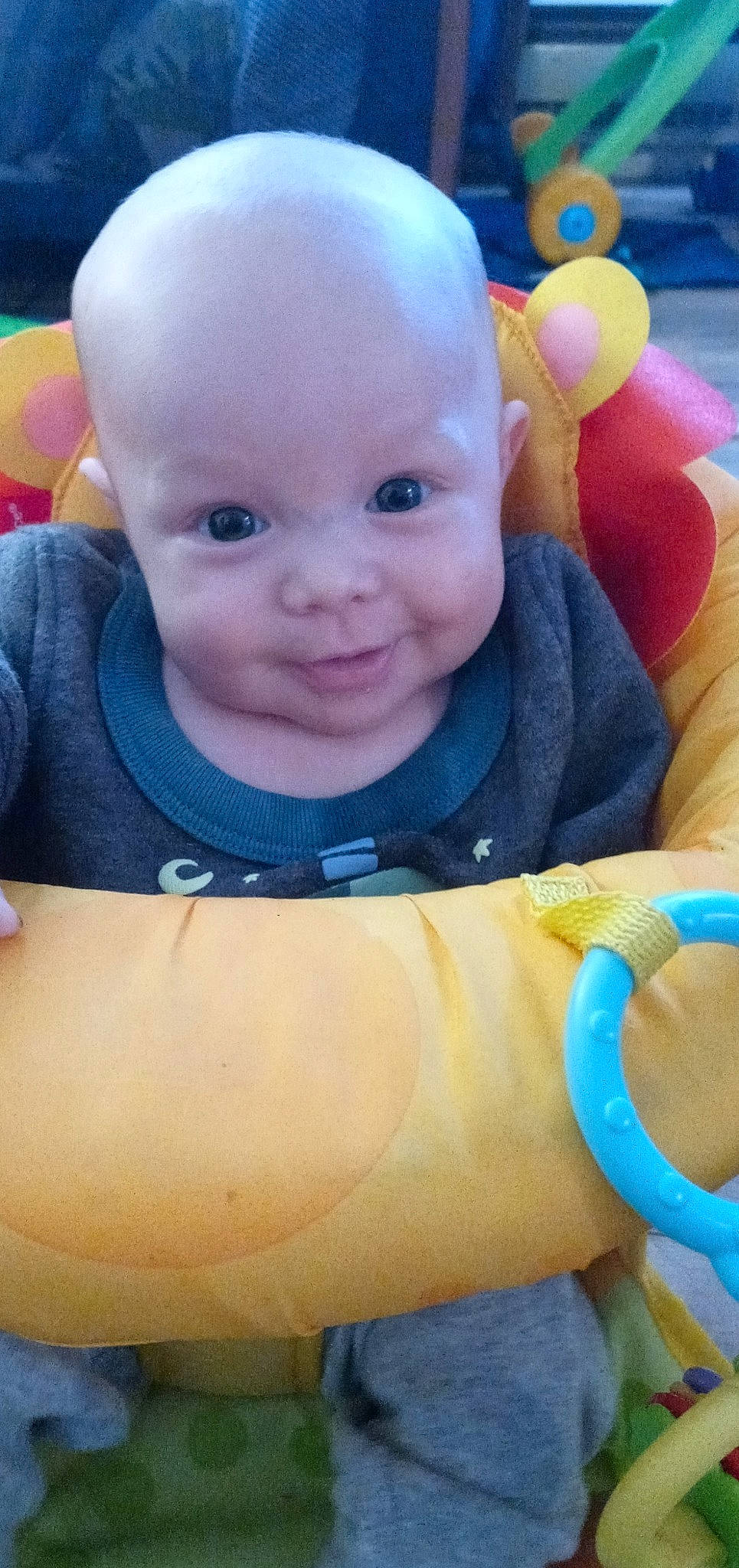 Baker is registered to the contest to win money with this photo: baby, baby_toys, cheek, child, face, head, joy, person, play, skin, smile, toddler, toy, tummy_time