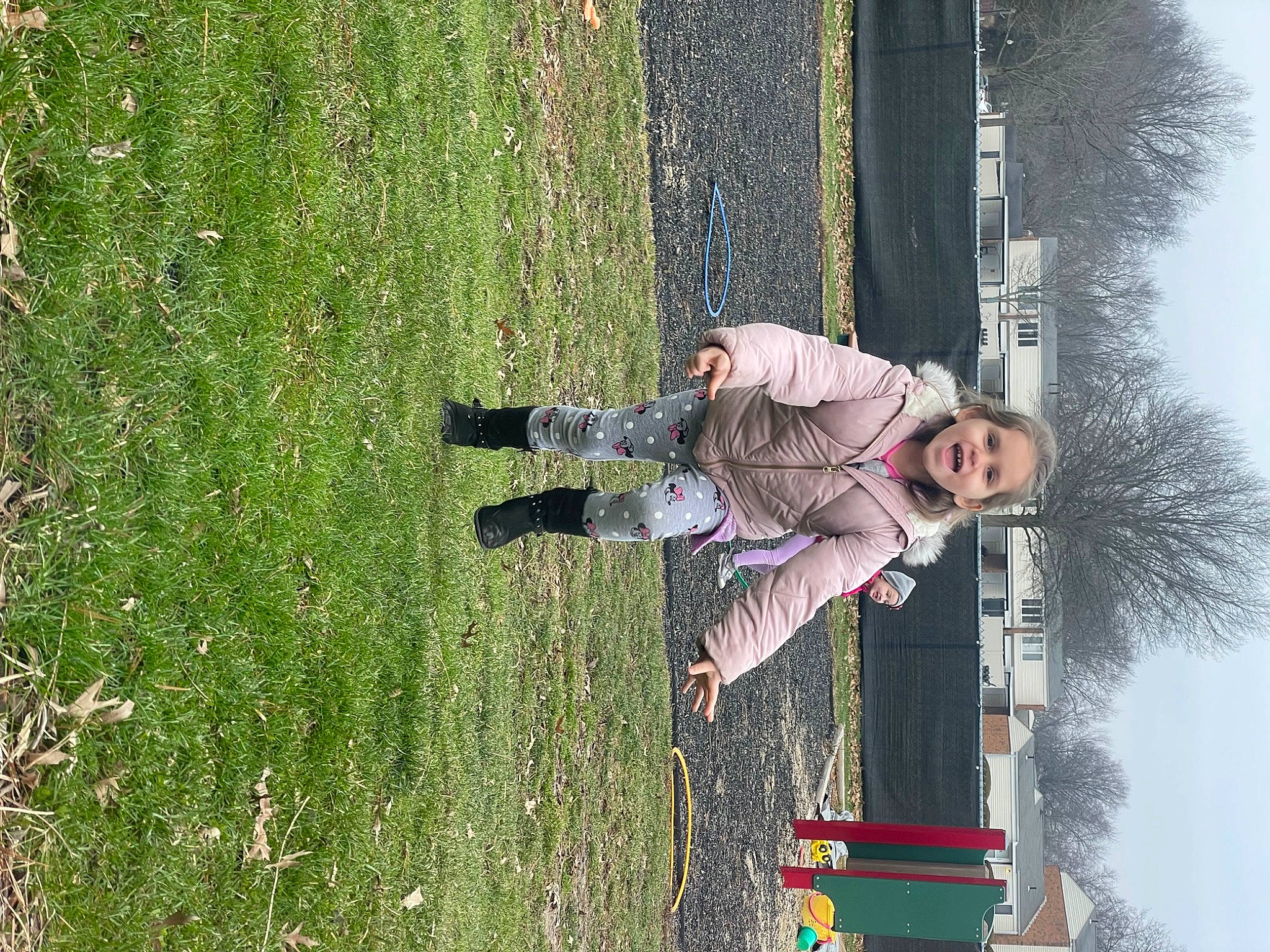 Scarlett is registered to the contest to win money with this photo: fun, grass, grassland, leisure, people_in_nature, person, plant, recreation, reflection, shadow, shrub, sky, toddler, tree, woody_plant