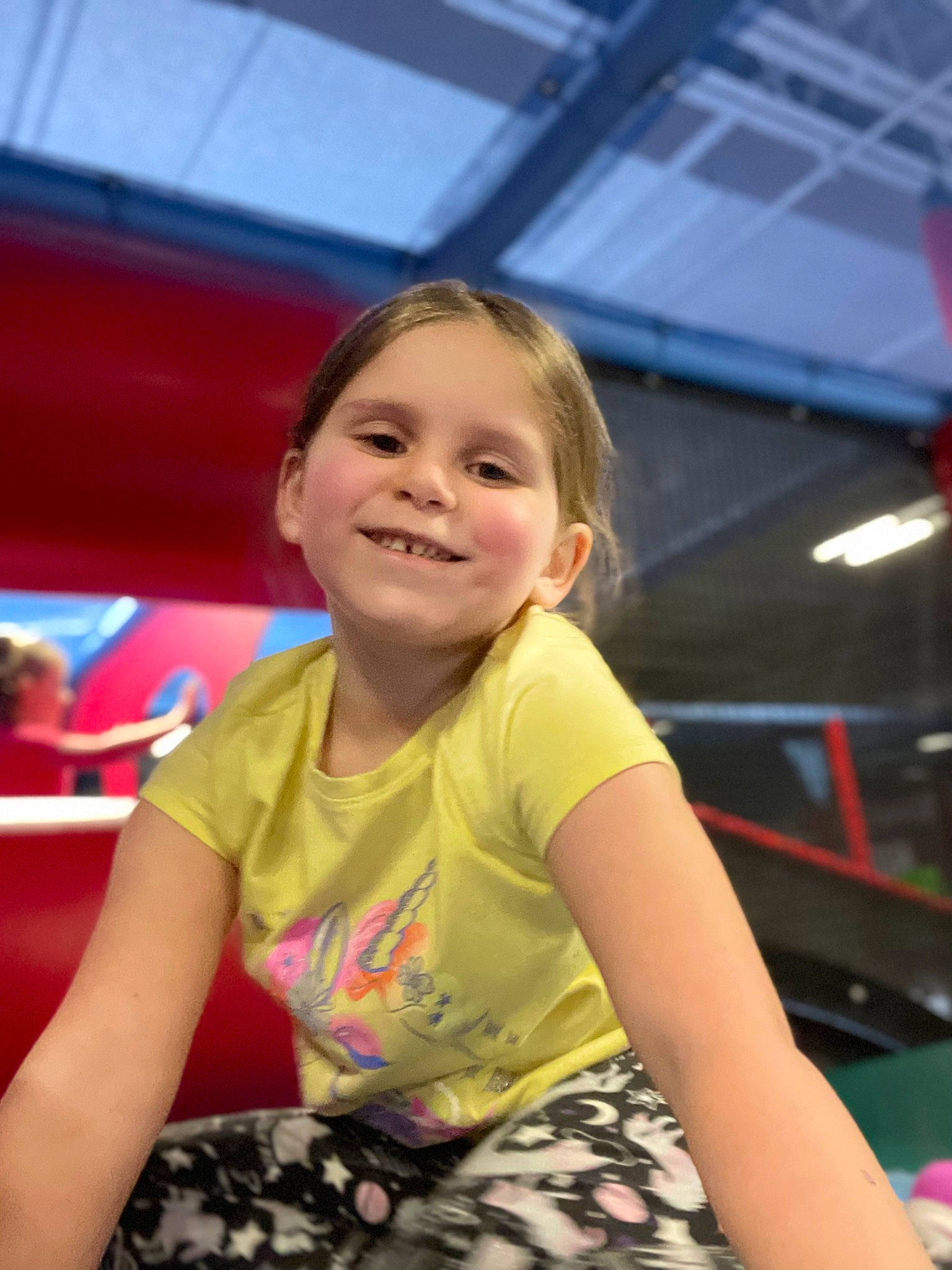 Scarlett is registered to the contest to win money with this photo: blond, bumper, child, event, fun, happy, human_body, joy, laugh, leisure, magenta, motor_vehicle, person, play, recreation, sitting, skin, smile, t_shirt, thigh