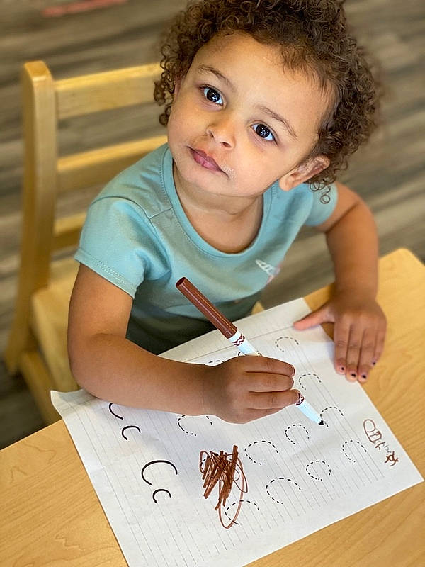 Izzy joined the competition — help win amazing prizes! artist, child, eye, face, finger, flooring, font, fun, hand, handwriting, happy, homework, office_supplies, person, snapshot, t_shirt, table, toddler, writing, writing_implement