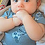 Micheal is registered to the contest to win money with this photo: baby, infant, child, face, hand, onesie, blue_clothing, blanket, car_seat, warning_label, cute, sucking_fist, chubby_cheeks, portrait, indoors, soft_texture, young_child, closeup, expression, human
