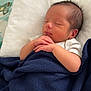 Micheal is registered to the contest to win money with this photo: newborn, baby, sleeping, blanket, white_pillow, infant, peaceful, hands, clasped_hands, bed, soft, cozy, indoors, cute, rest, child, person, portrait, sleep, toddler