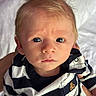 Maximillian joined the competition — help win amazing prizes! baby, infant, child, face, portrait, blue_eyes, striped_clothing, black_and_white, hair, expression, hands, cute, closeup, soft_lighting, indoor, person, newborn, looking_at_camera, human, casual