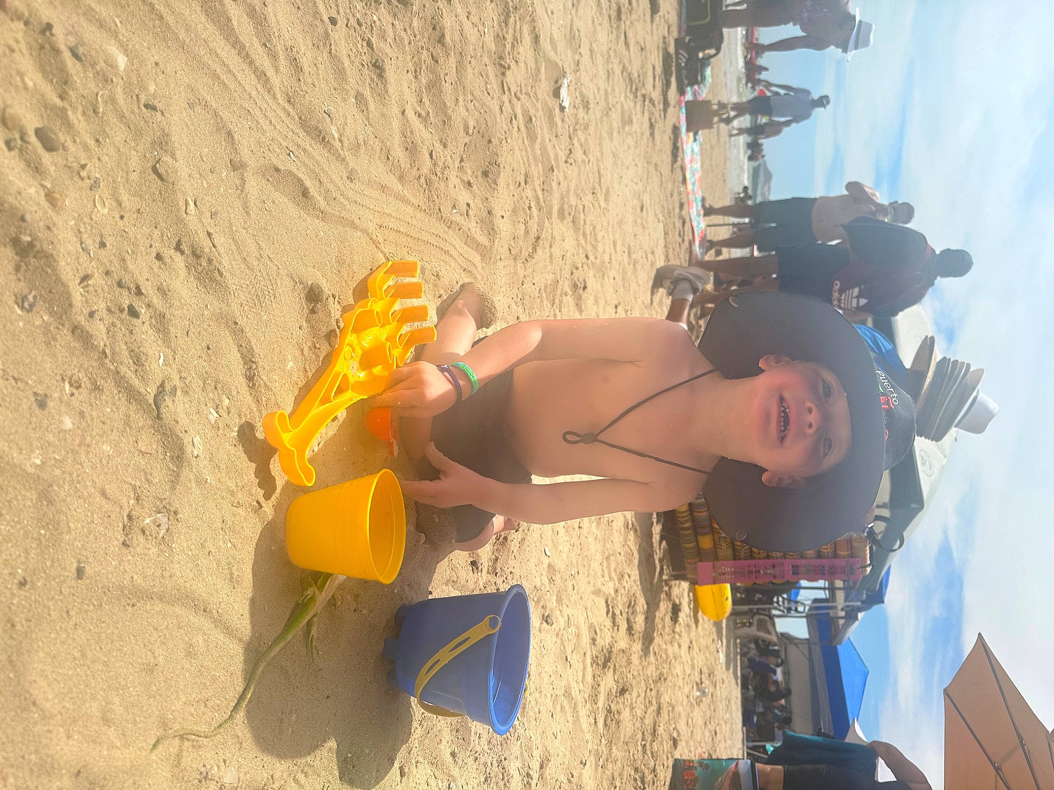 Gabriel joined the competition — help win amazing prizes! adventure, beach, elbow, fun, headwear, human_leg, landscape, leisure, person, recreation, sand, shadow, shorts, sky, smile, soil, thigh, toddler, travel, vacation