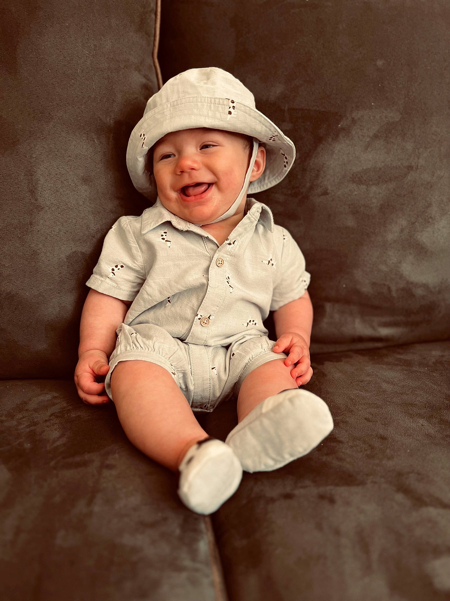 Nash is registered to the contest to win money with this photo: baby, baby_toddler_clothing, cap, child, costume_hat, fashion_accessory, flash_photography, flooring, fun, happy, headwear, joy, monochrome, pattern, person, portrait_photography, sitting, skin, sleeve, smile