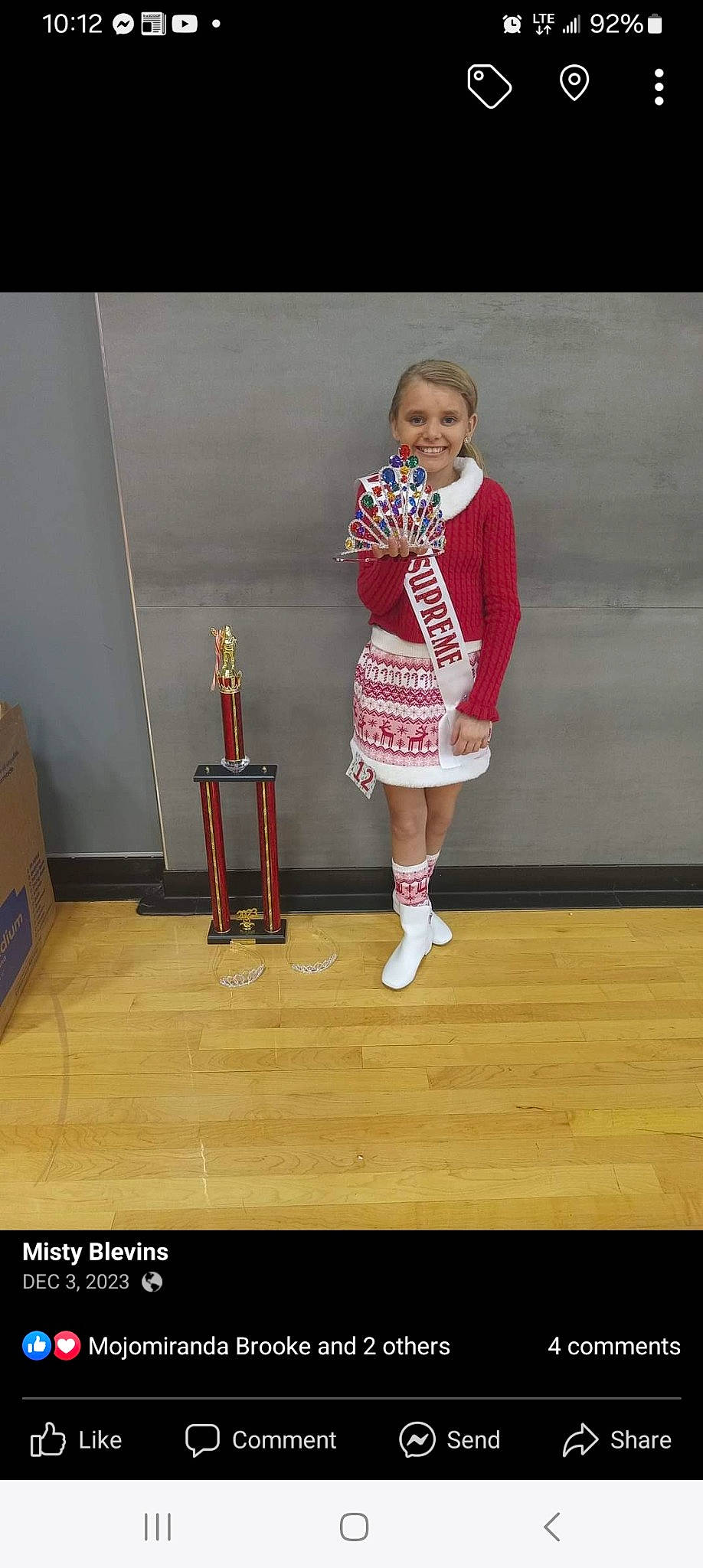 Sadie Blevins is registered to the contest to win money with this photo: boot, child, competition_event, event, fashion_design, flooring, fun, hardwood, human_leg, jersey, joy, knee, leg, person, shorts, smile, sock, sportswear, thigh, toddler