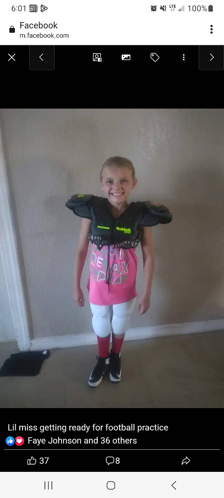 Sadie Blevins is registered to the contest to win money with this photo: baby_toddler_clothing, boot, chair, face, fun, human_leg, jersey, joy, knee, leg, magenta, person, personal_protective_equipment, shoe, shoulder, sleeve, smile, sock, sportswear, t_shirt