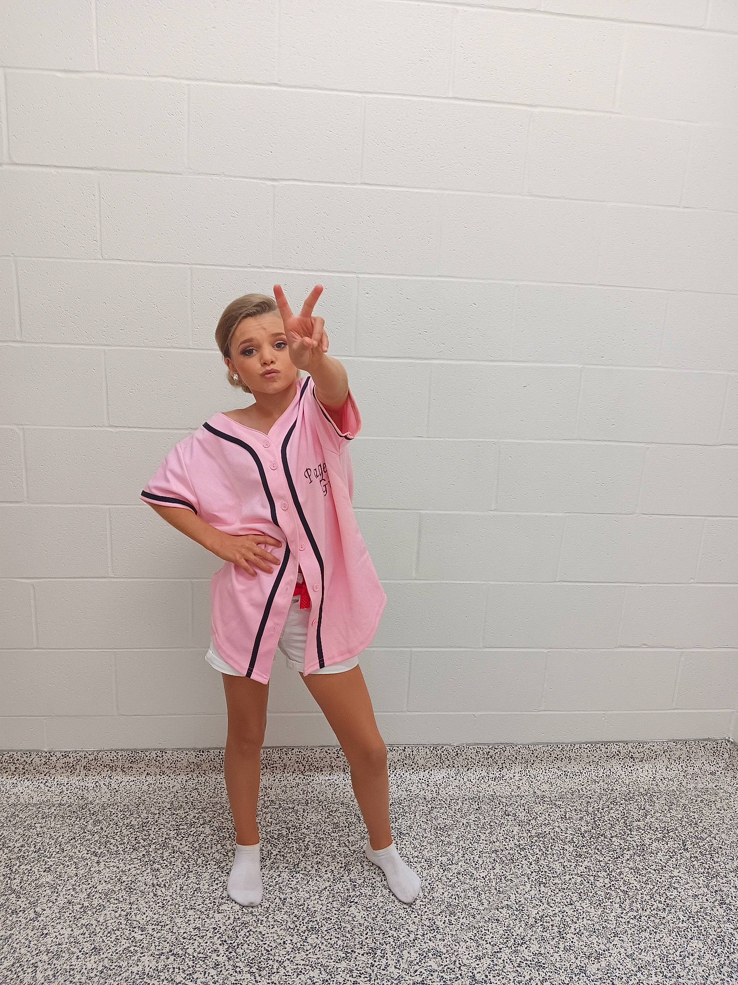 Sadie is registered to the contest to win money with this photo: bodypart, clothing, coat, dress, face, fashion, finger, footwear, formalwear, hand, head, hosiery, longsleeve, person, photography, portrait, shoe, shorts, sleeve, sock