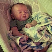 Nashtyn joined the competition — help win amazing prizes! baby, infant, sleeping, blanket, soft, cushion, newborn, cute, peaceful, indoors, resting, cozy, child, person, wrapped, foot, hand, smile, fabric, seat