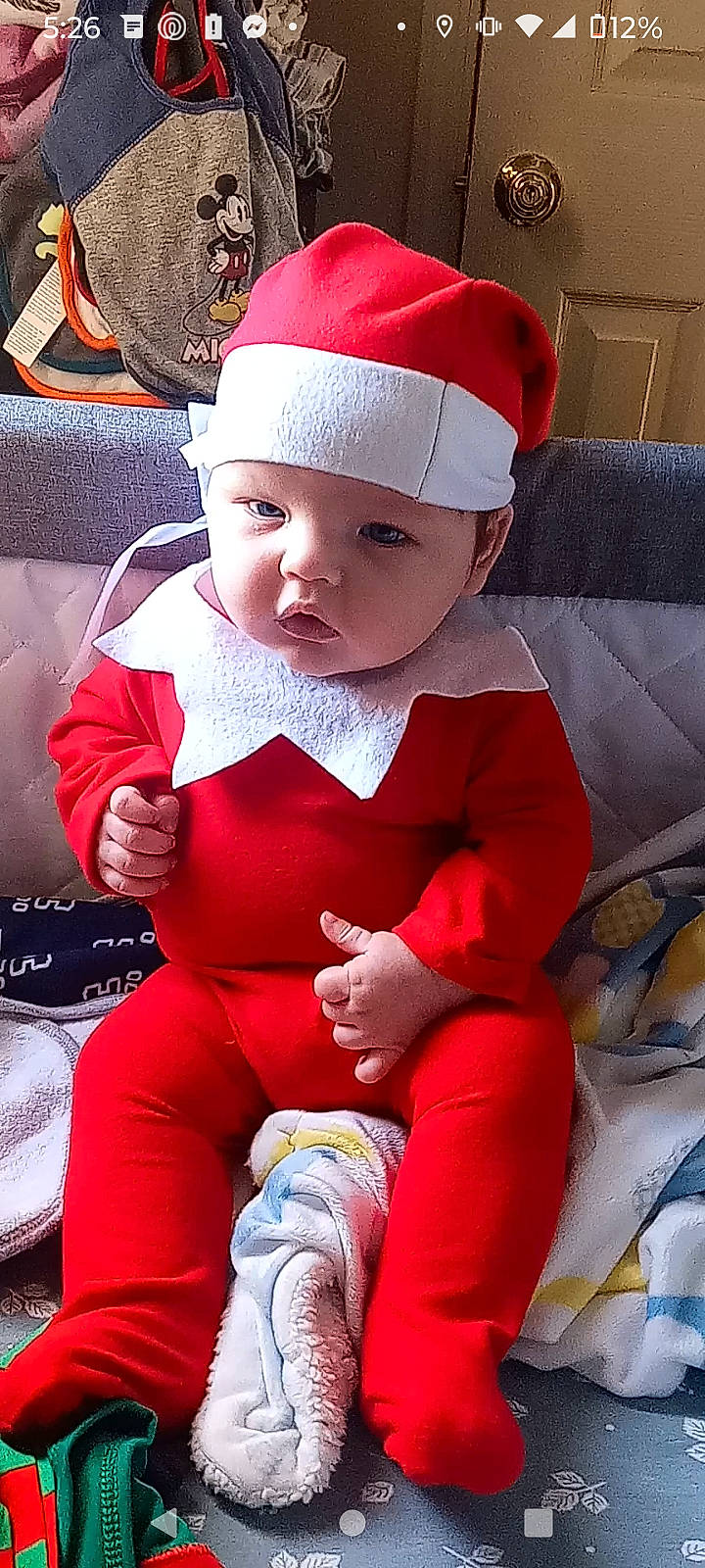 Ozias Nathaniel Ramirez is registered to the contest to win money with this photo: baby, baby_toddler_clothing, cap, cheek, child, comfort, costume_hat, face, facial_expression, headgear, headwear, human_body, lap, lip, person, pink, red, santa_claus, skin, sleeve