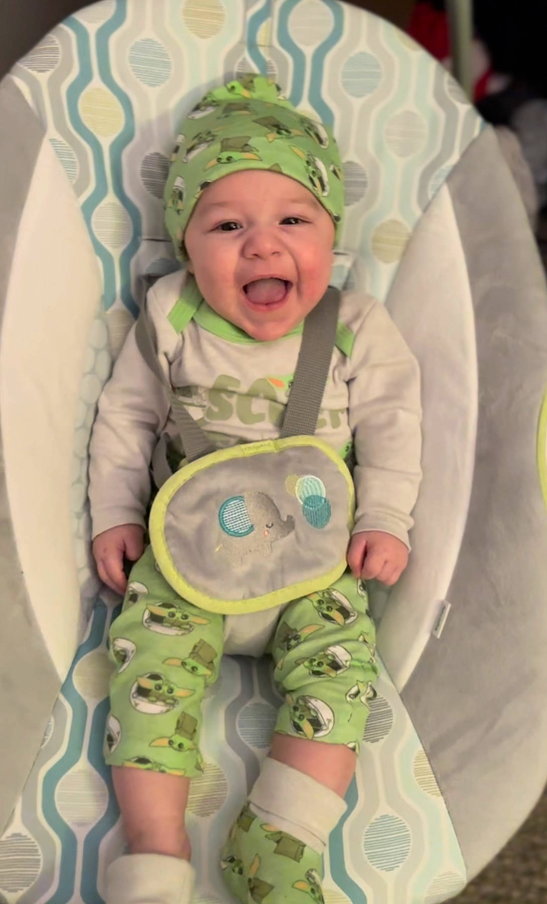 Atreus is registered to the contest to win money with this photo: baby, baby_toddler_clothing, child, comfort, cool, eye, face, facial_expression, green, happy, head, headwear, human, organ, people, person, photograph, product, skin, sleeve