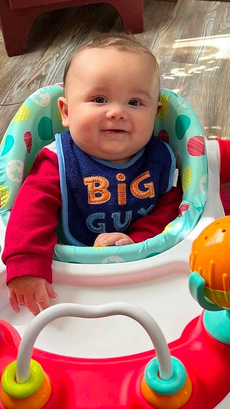 Bentley joined the competition — help win amazing prizes! baby, baby_playing_with_toys, baby_toddler_clothing, cheek, eye, facial_expression, finger, happy, iris, joy, mouth, nose, organ, person, pink, product, skin, sleeve, smile, textile