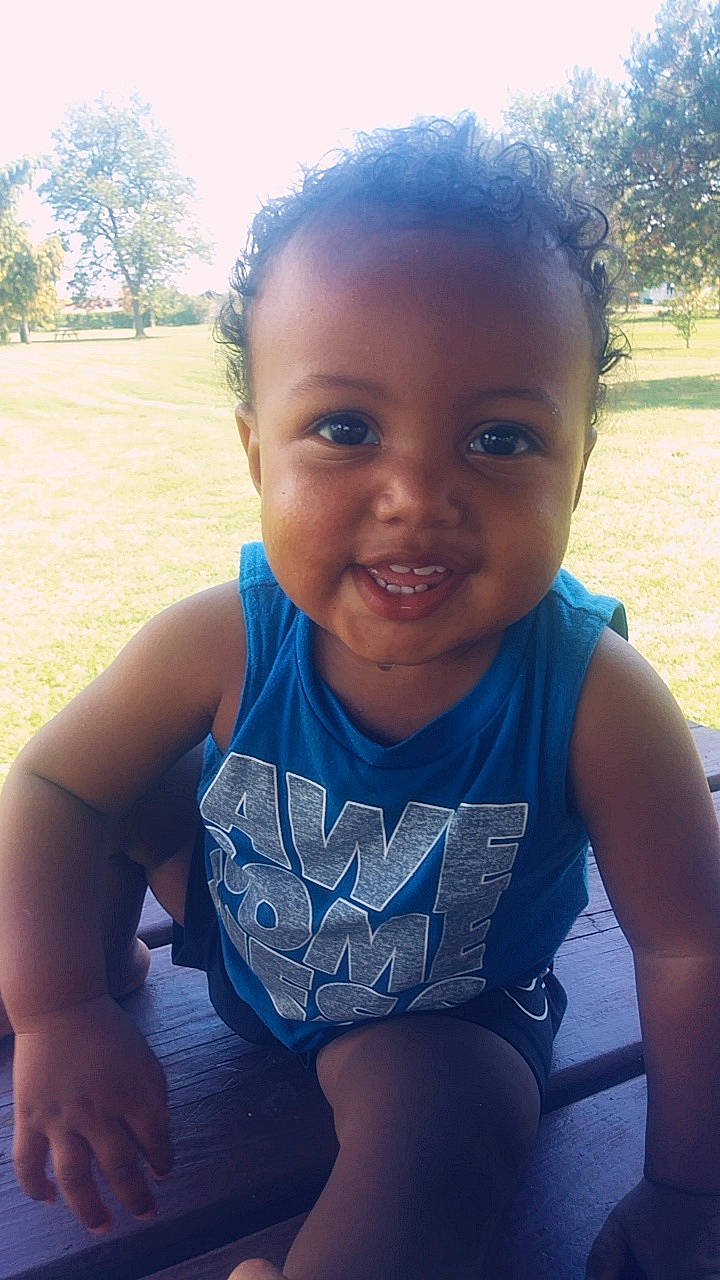Maximus is registered to the contest to win money with this photo: beauty, blue, cheek, child, day, emotion, eye, face, facial_expression, fun, girl, hairstyle, head, infant, joy, person, sitting, skin, smile, standing