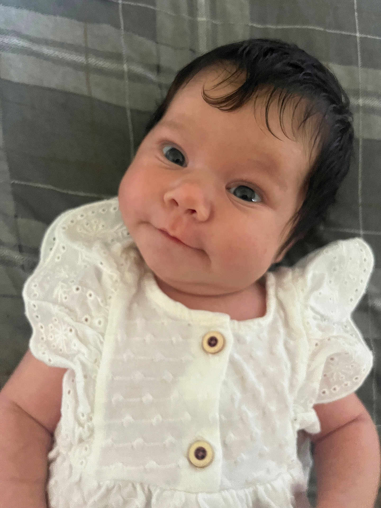 Aurora-Mai is registered to the contest to win money with this photo: baby, infant, face, eyes, hair, skin, white_clothing, button, cute, portrait, newborn, child, lying_down, soft_texture, fabric, close_up, expression, person, small_hands, indoors